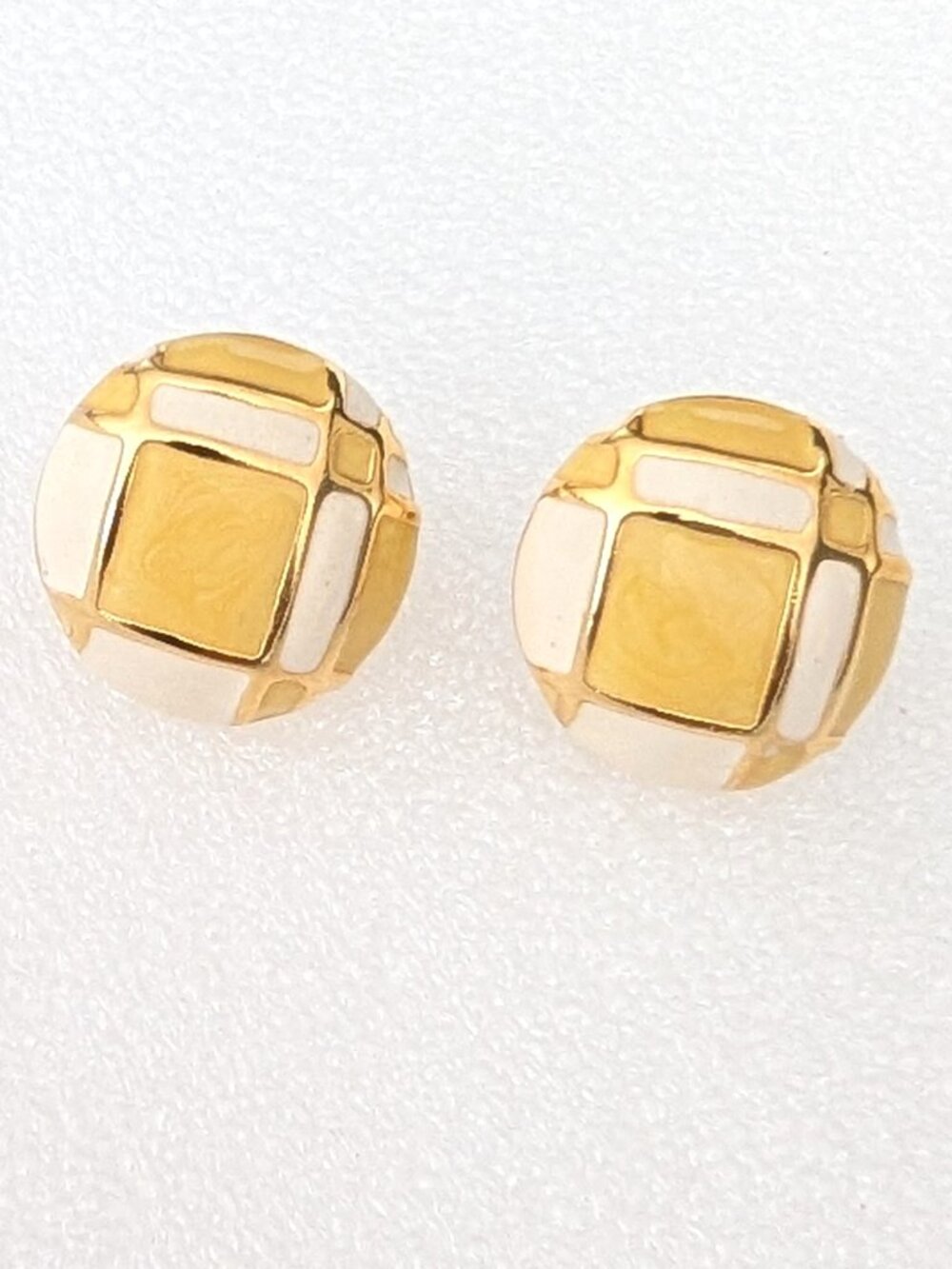 Vintage yellow and cream enamel clip on earrings with gold tone accents